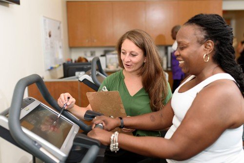 Pictured: Exercise physiologist supervisor Meghan Michalski with a patient