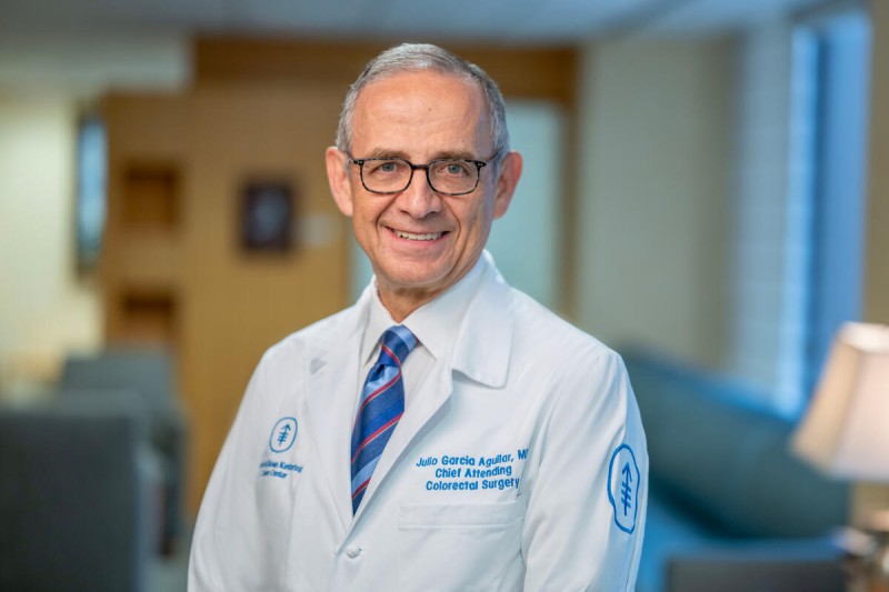 Colorectal surgeon Dr. Julio Garcia-Aguilar seen smiling in office.