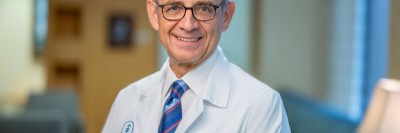 Colorectal surgeon Dr. Julio Garcia-Aguilar seen smiling in office.