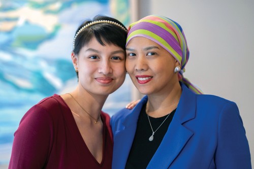 Sisters Jo and Jan Claire Luzarraga are seen smiling. 