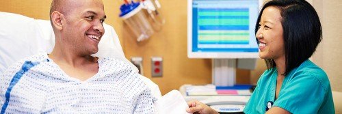 Nurse Dara Lugay cares for a patient who's had surgery.