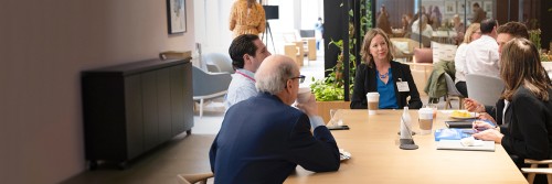 Health Benefits Consultants in Discussion Around Table